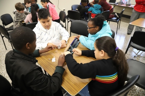 5th graders working on math problem